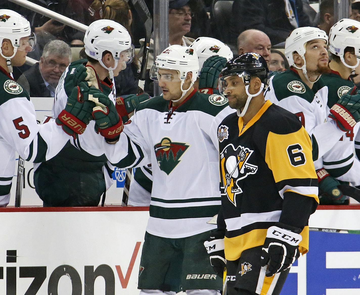 Minnesota Wild's Nino Niederreiter (22) returns to teh bench after his goal as Pittsburgh Penguins' Trevor Daley (6) skates past during the second period of an NHL hockey game in Pittsburgh, Thursday, Nov. 10, 2016. (AP Photo/Gene J. Puskar)