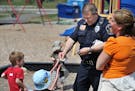 Elko New Market Police Chief Rick Jensen handed out police stickers to children at a playground while on patrol Friday. The City Council voted unanimo