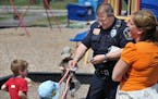 Elko New Market Police Chief Rick Jensen handed out police stickers to children at a playground while on patrol Friday. The City Council voted unanimo