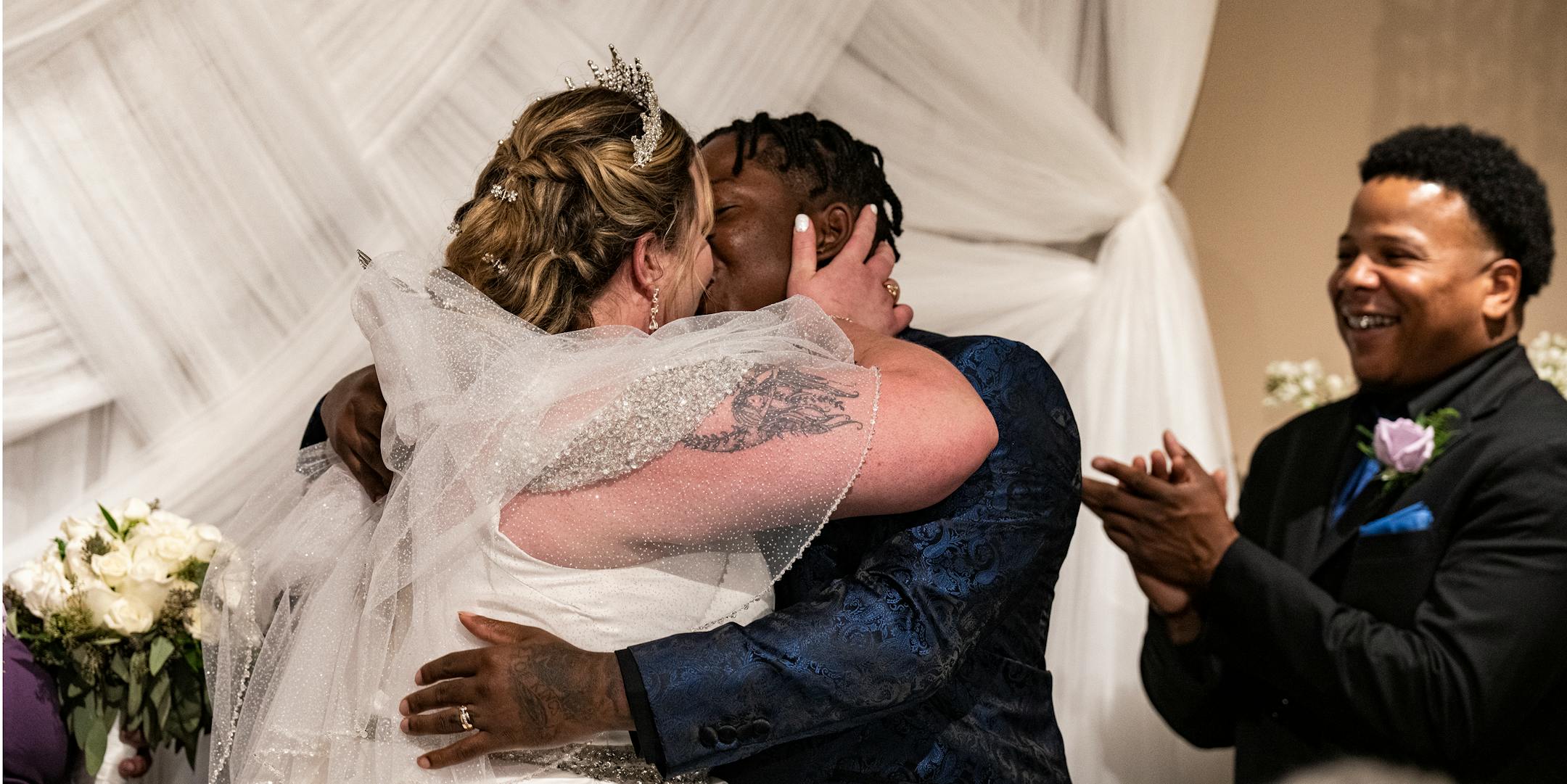 Andrea and Samuel Price seal their vows with a kiss.
