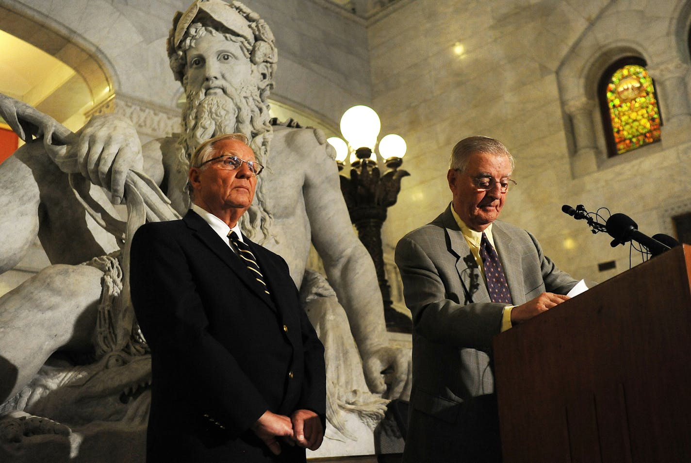 Former Minnesota Gov. Arne Carlson, left, and former Vice President Walter Mondale listen to questions during a news conference on Tuesday, July 5, 2011 in Minneapolis. Mondale and Carlson announced an independent commission designed to resolve Minnesota's budget deadlock. Carlson and Mondale won't serve on the panel. They say it will be co-chaired by Republican former state Sen. Stephen Dille and Democratic former state Rep. Wayne Simoneau. The commission will also include Gov. Mark Dayton's bu