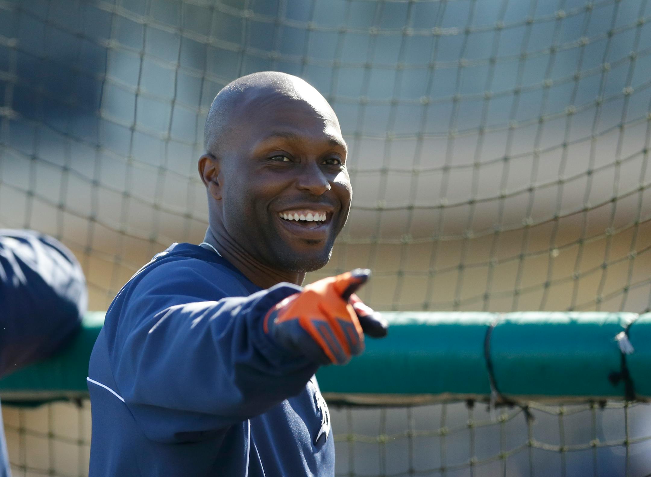 Detroit Tigers right fielder Torii Hunter points to a fan before a spring exhibition baseball game against the Miami Marlins in Lakeland, Fla., Thursday, March 13, 2014. (AP Photo/Carlos Osorio)