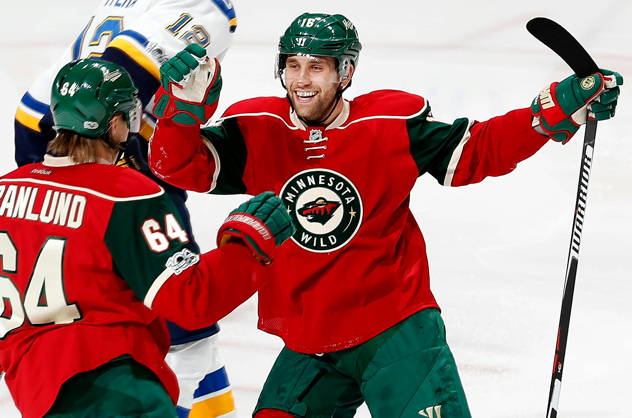 Mikael Granlund (64) and Jason Zucker (16) celebrated a goal.