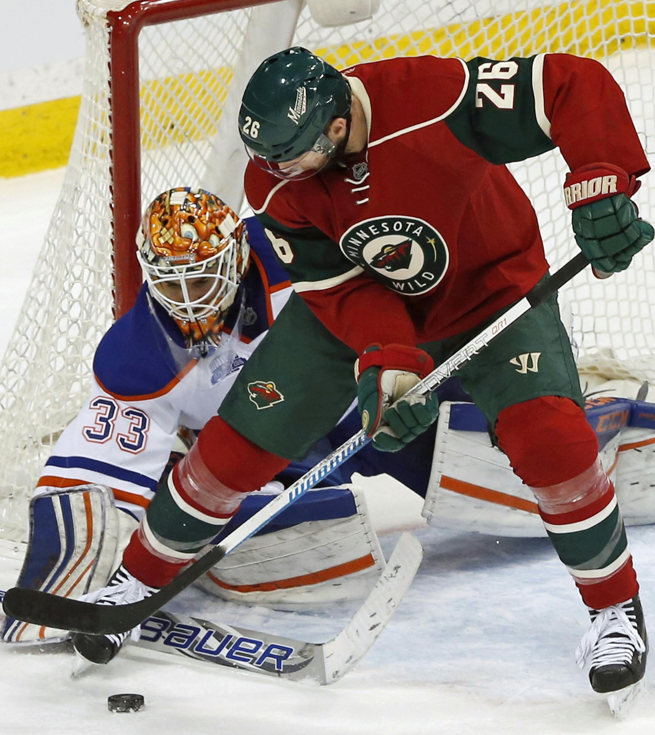 Edmonton Oilers goalie Cam Talbot (33) stops a scoring threat by Minnesota Wild's Thomas Vanek, of Austria, in the third period of an NHL hockey game Thursday, March 10, 2016, in St. Paul, Minn. (AP Photo/Jim Mone) ORG XMIT: MNJM112