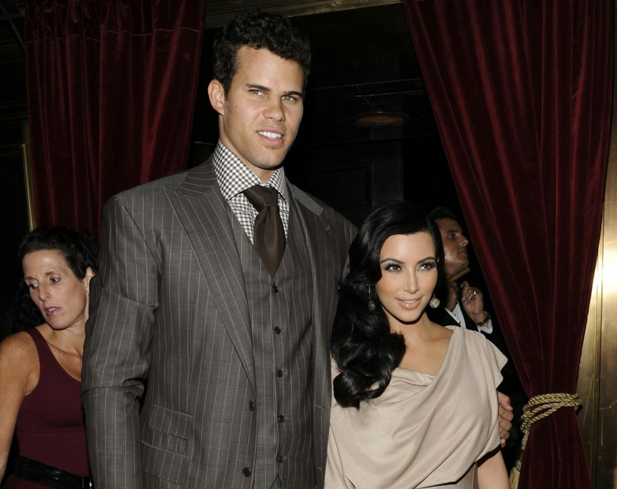 FILE - This Aug. 31, 2011 file photo shows Kim Kardashian and Kris Humphries attending a party thrown in their honor at Capitale in New York. Kardashian's attorney Laura Wasser told a judge on Wednesday Nov. 28, 2012 that the reality starlet is "handcuffed" to her estranged husband, Humphries, and unable to move on with her life because the NBA player continues to seek an annulment but is not ready for trial.