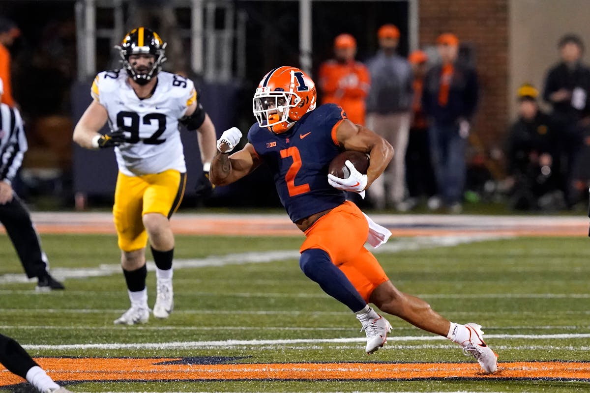 Illinois running back Chase Brown carries the ball against Iowa last weekend.
