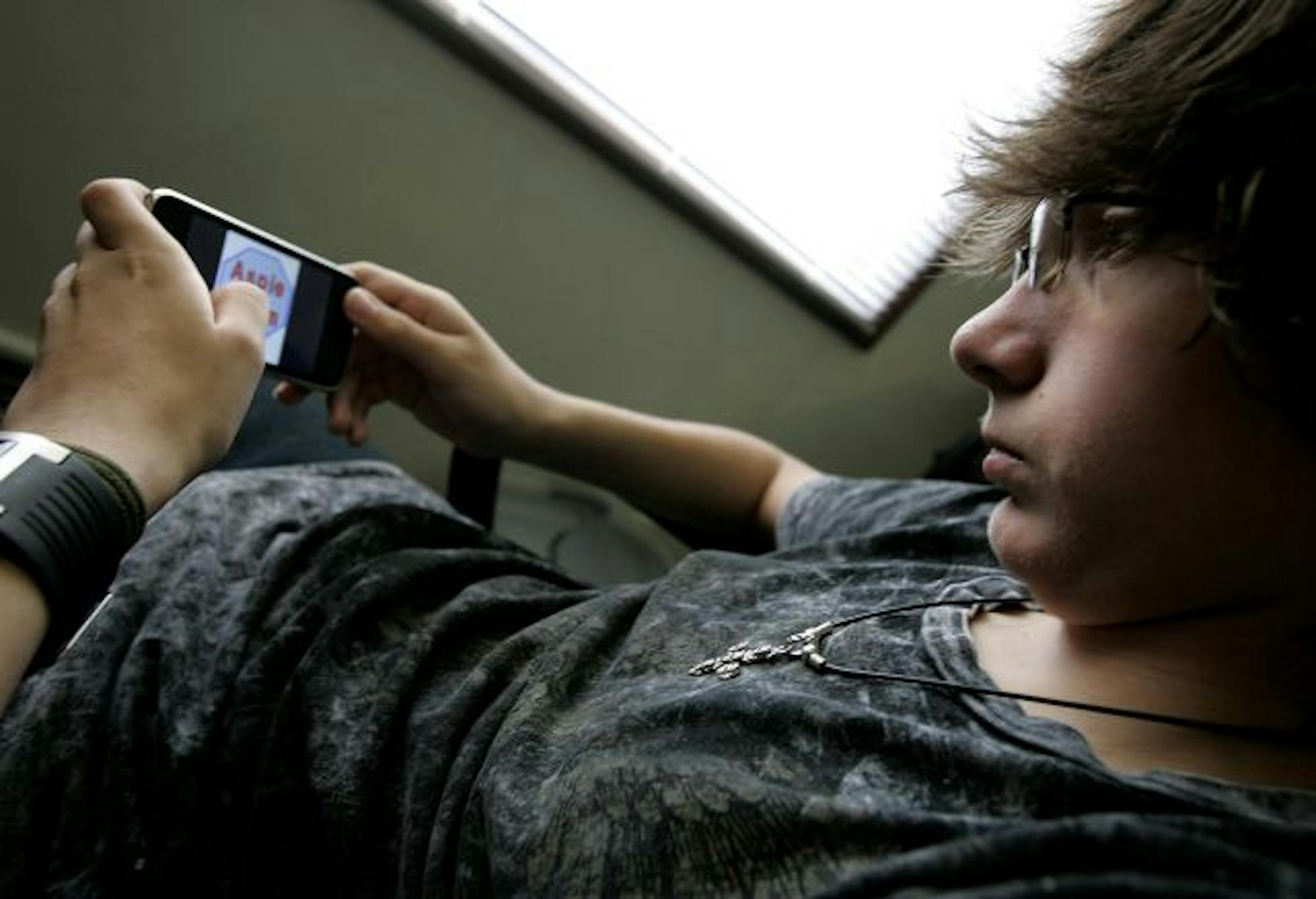 P.J. O'Riley, 15, is in the Asperger's syndrome treatment program at Fraser Child & Family Center in Minneapolis, where teenagers are using iPods to help cope with their disability.