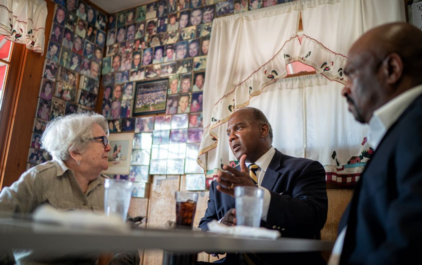 Kendall Qualls talked with Marina Kontorovich, left and Eric Hines, right. He had lunch with supporters at Peg's Countryside Cafe in Hamel, Minnesota. Qualls is running for Congress in CD3 against Democrat Dean Phillips.