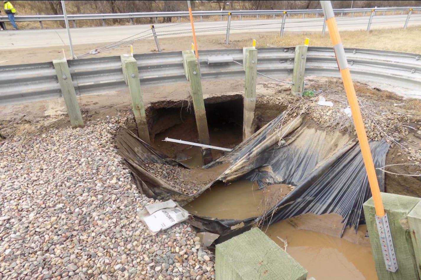 A water main break led to this sinkhole along I-694.