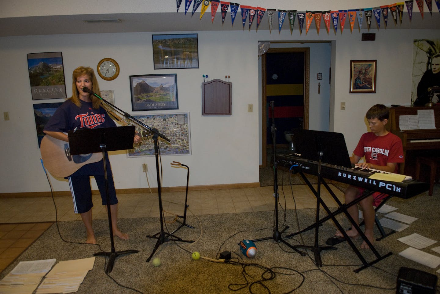 Janelle Kendall practices music in her basement preparing for performances at their local church worship services. Oldest son Andrew plays keyboards in the family band as well as in the high school jazz band.