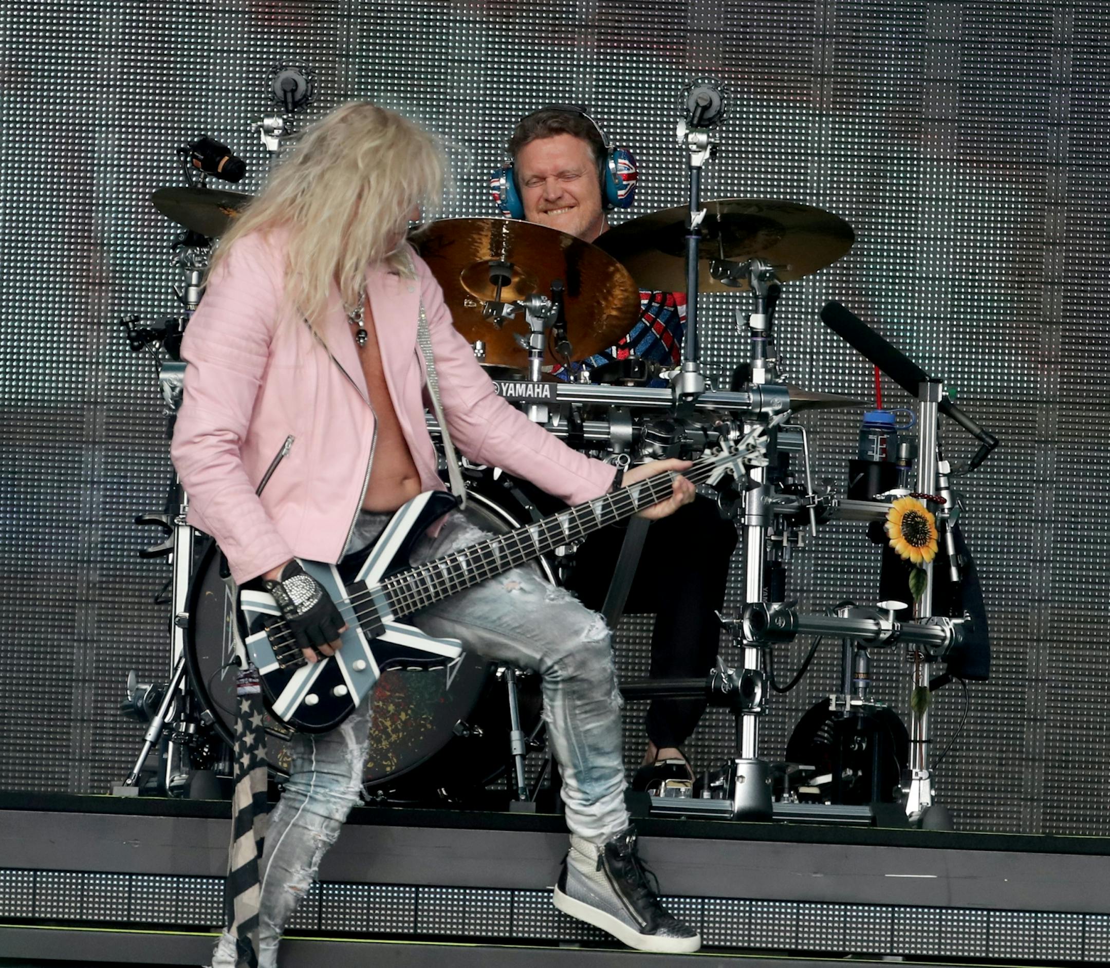 Def Leppard, including Rick Allen on drums, and Rick Savage on bass guitar, performed Friday, July 27, 2018, at Target Field in Minneapolis, MN.