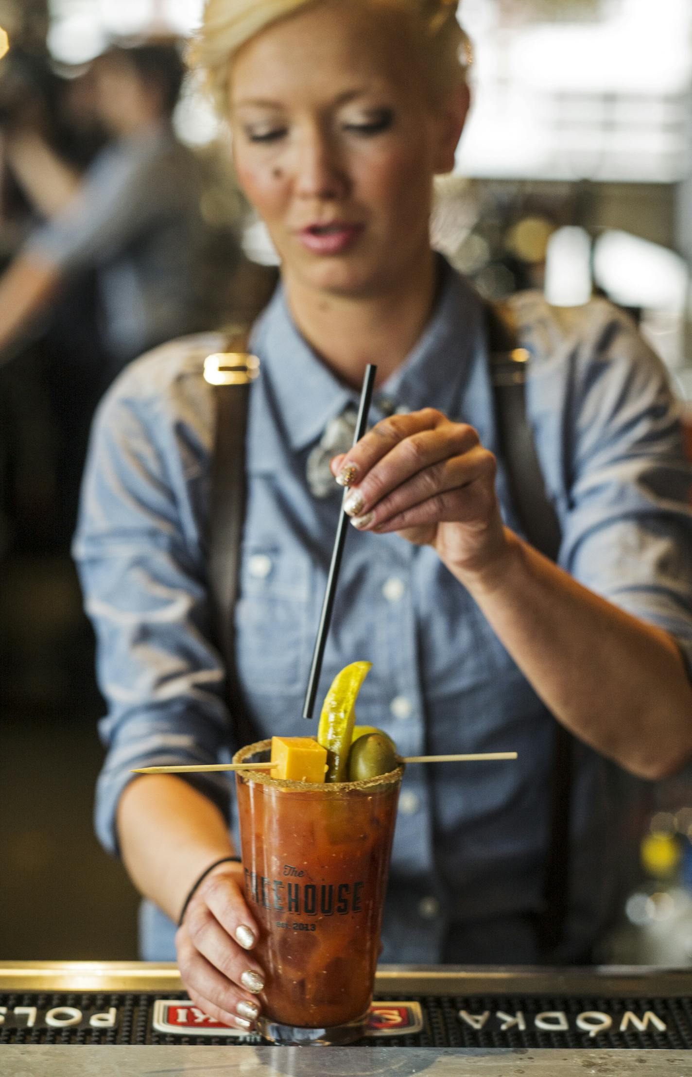 At the Freehouse, Brittany Conkright-Kolu crafted a Bloody Mary for a customer, the first legal one before 10 a.m. on Sunday under the new liquor law.] Richard Tsong-Taatarii/rtsong-taatarii@startribune.com