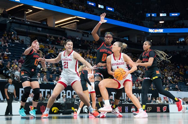 Nebraska guard Jaz Shelley (1) drives in on Maryland guard Shyanne Sellers (0) during the first quarter of Saturday's Big Ten tournament semifinals. S