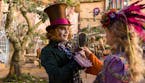 In this image released by Disney, Johnny Depp, left, and Mia Wasikowska appear in a scene from "Alice Through The Looking Glass." (Peter Mountain/Disn