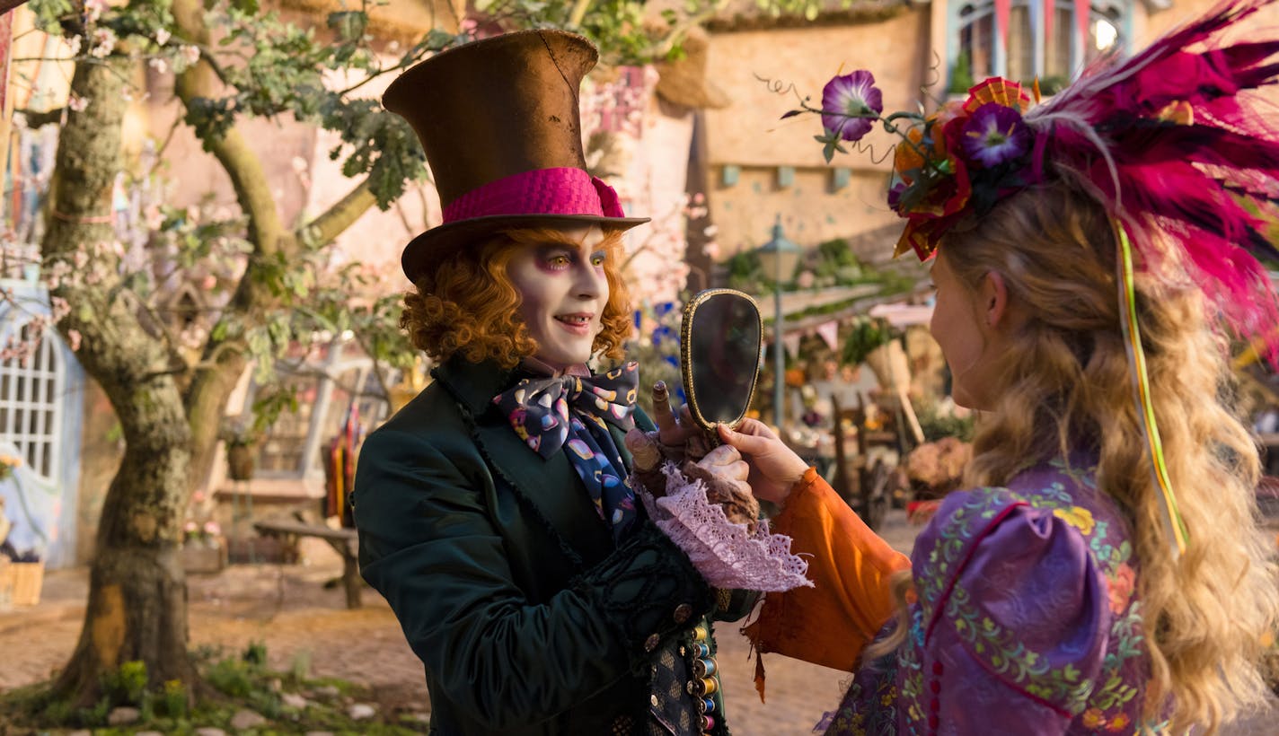 In this image released by Disney, Johnny Depp, left, and Mia Wasikowska appear in a scene from "Alice Through The Looking Glass." (Peter Mountain/Disney via AP)