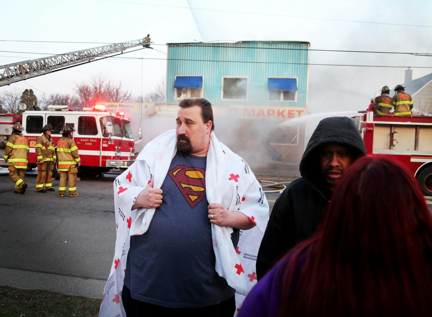 An early morning fire at Stasny's Food Market claimed the life of one male employee Thursday, April 14, 2016, in St. Paul, MN. Here, upstairs tenant Tim Schmugge escaped with his finance Eva Tietz and their two children but lost all their belongings. "Everything's gone," Schmugge said. "It's pretty rough."](DAVID JOLES/STARTRIBUNE)djoles@startribune.com An early morning fire at Stasny's Food Market claimed the life of one male employee Thursday, April 14, 2016, in St. Paul, MN.**Tim Schmugge, Ev