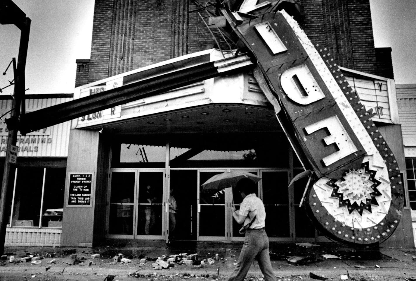 October 8, 1981 Damaged landmark is replaced: The picture above was taken June 14, after a tornado toppled the Art Deco sign on the Edina Theater, 3911 W. 50th St. The 47-year-old landmark proved to be damaged beyond repair. Wednesday a new sign, identical to the old one, was placed atop the theater by workers from the LeRoy Sign Co., Minneapolis. The company worked from original blueprints to duplicate the 29-foot, 3,000-pound sign. At 6:15 p.m. it was turned on, giving the city back a piece of