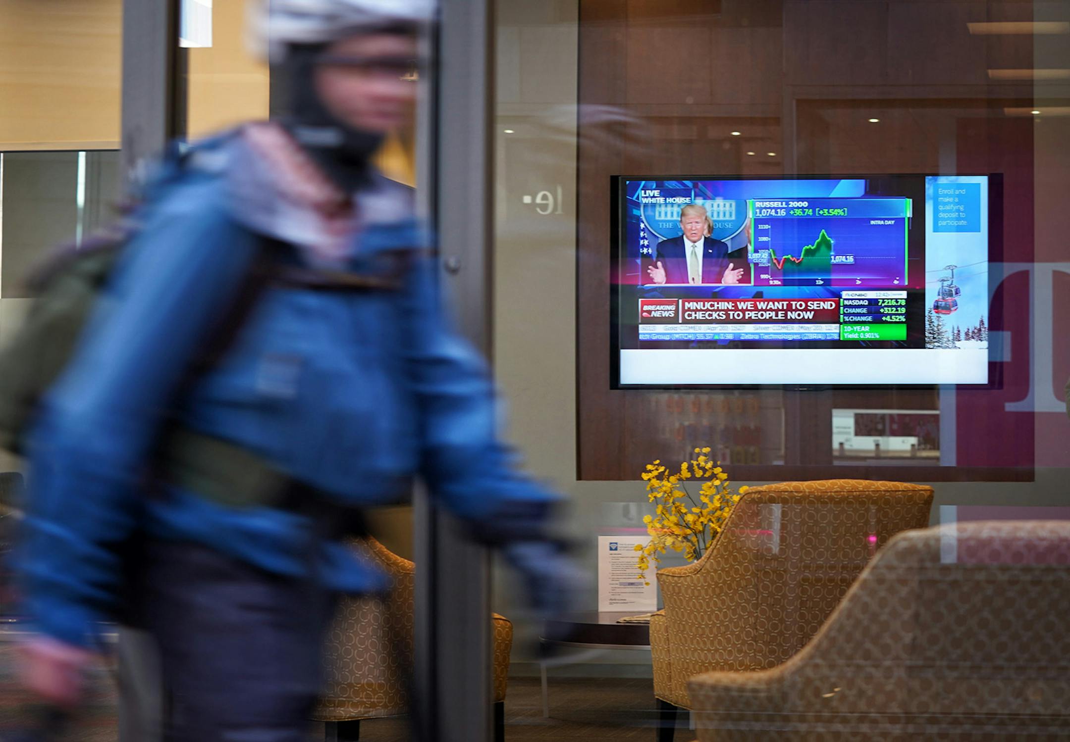 President Trump's news conference and the live stock chart were on a television monitor in the downtown Minneapolis Charles Schwab branch on Nicollet Mall in the skyway.