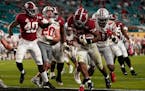 Alabama running back Najee Harris scores a touchdown against Ohio State during the second half of an NCAA College Football Playoff national championsh