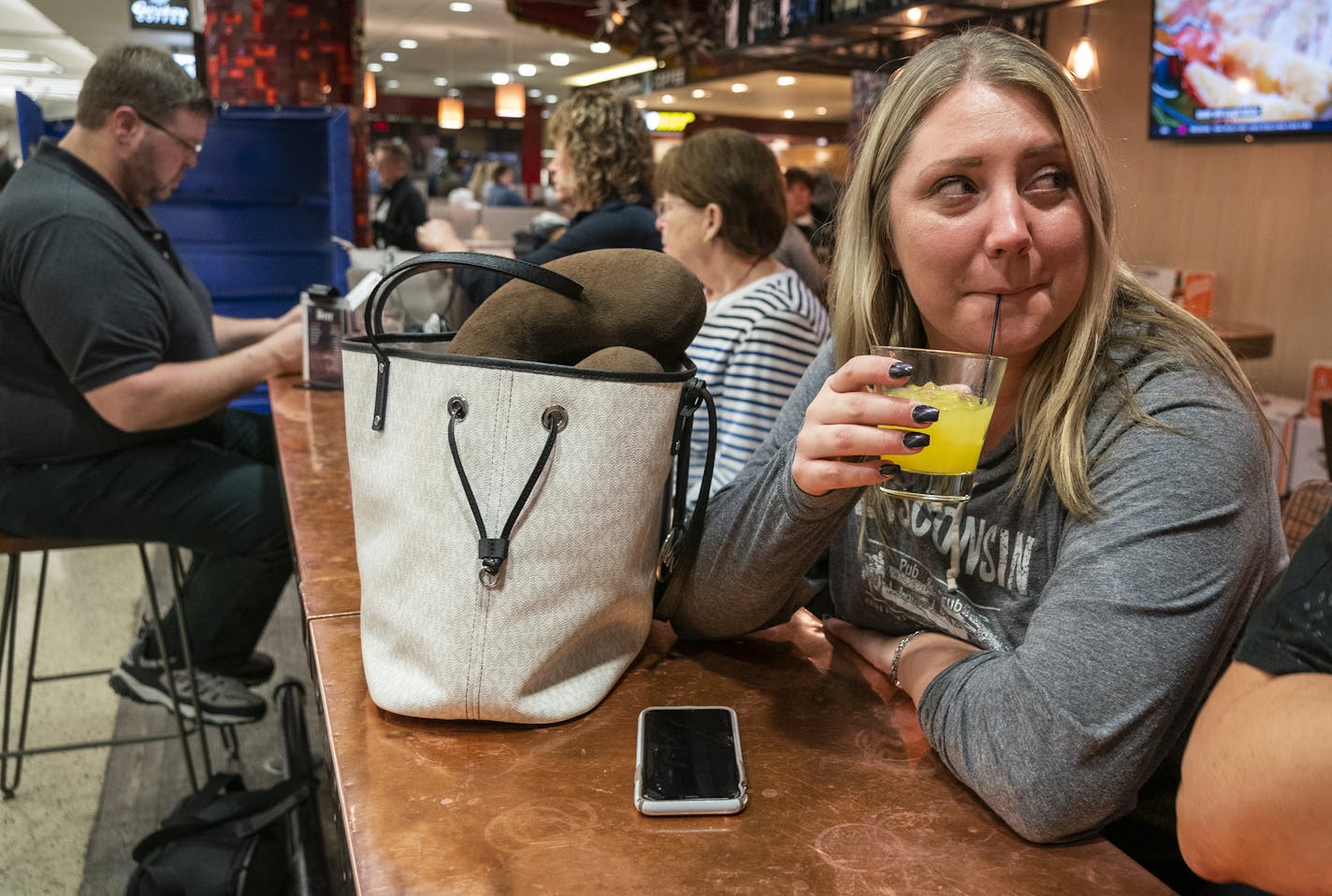 Samantha Fuller of Rochester enjoyed an early morning cocktail with family at Cocina del Barrio in MSP Terminal 2 just after 6 a.m. while waiting to board a flight to Mexico for vacation. ] LEILA NAVIDI &#x2022; leila.navidi@startribune.com BACKGROUND INFORMATION: Travelers enjoy early morning drinks at Cocina del Barrio in Terminal 2 of Minneapolis - St. Paul International Airport before boarding flights on Friday, January 31, 2020.