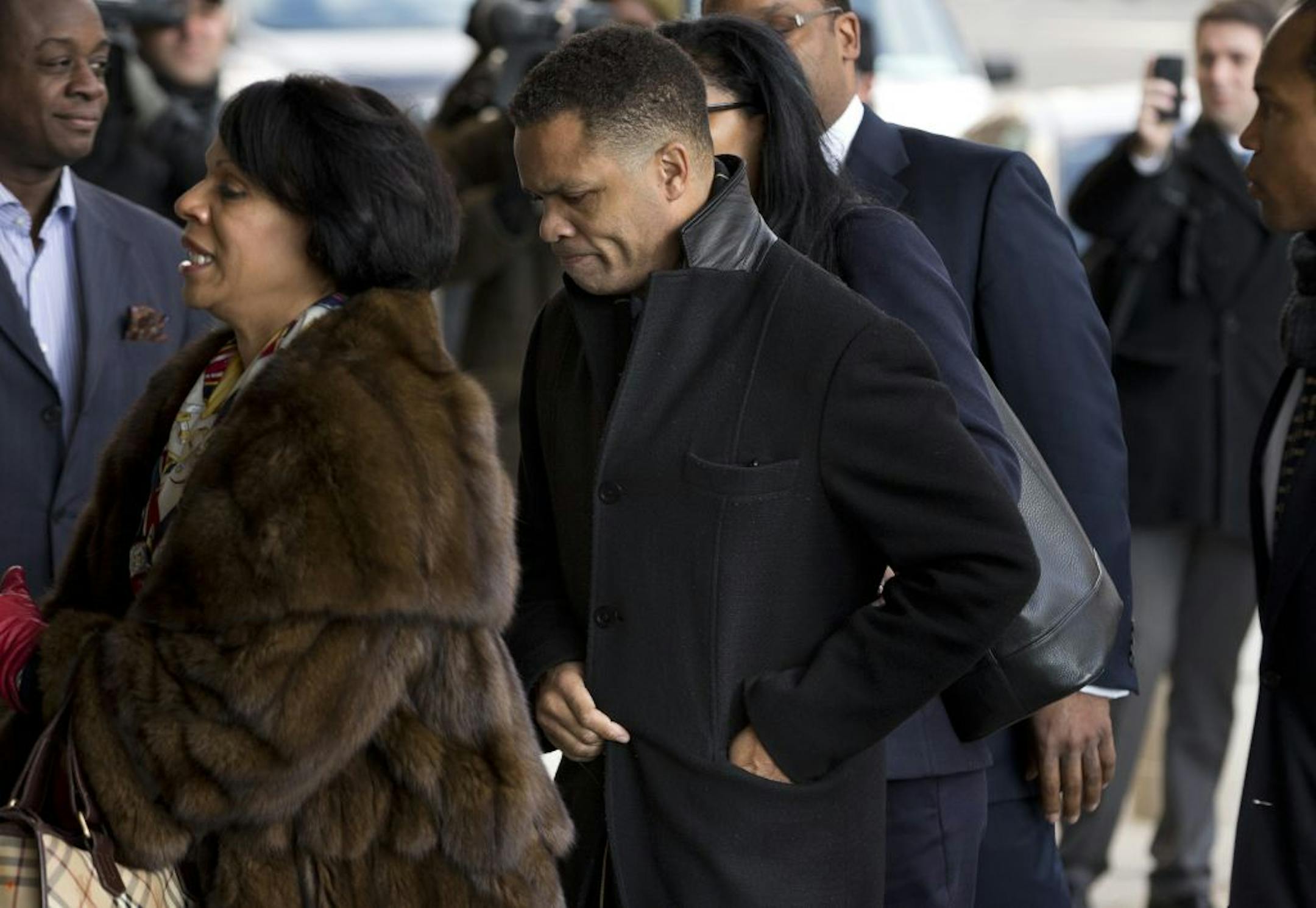 Former Illinois Rep. Jesse Jackson Jr. and his legal team arrives at the E. Barrett Prettyman Federal Courthouse in Washington, Wednesday, Feb. 20, 2013. Jackson and his wife were to appear in federal court to answer criminal charges that they engaged in an alleged scheme to spend $750,000 in campaign funds on personal items.