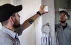 Geek Squad member Kyle Foresman installing a motion sensor that is part of a suite of new products to help seniors live independently.