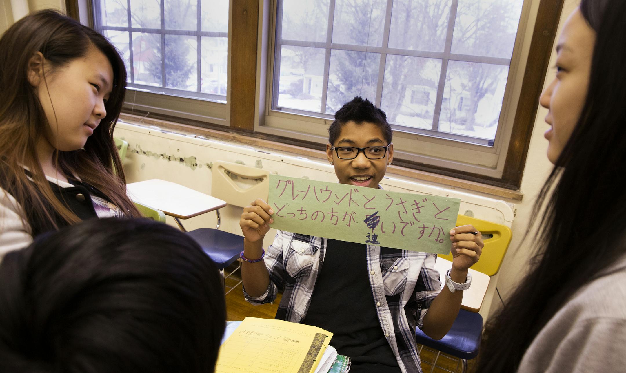 Senior Kia Lao, from left, 17, junior Gem Fields, 16, and junior Samantha Yang, 16, worked together during Japanese III class at Patrick Henry High School in Minneapolis.