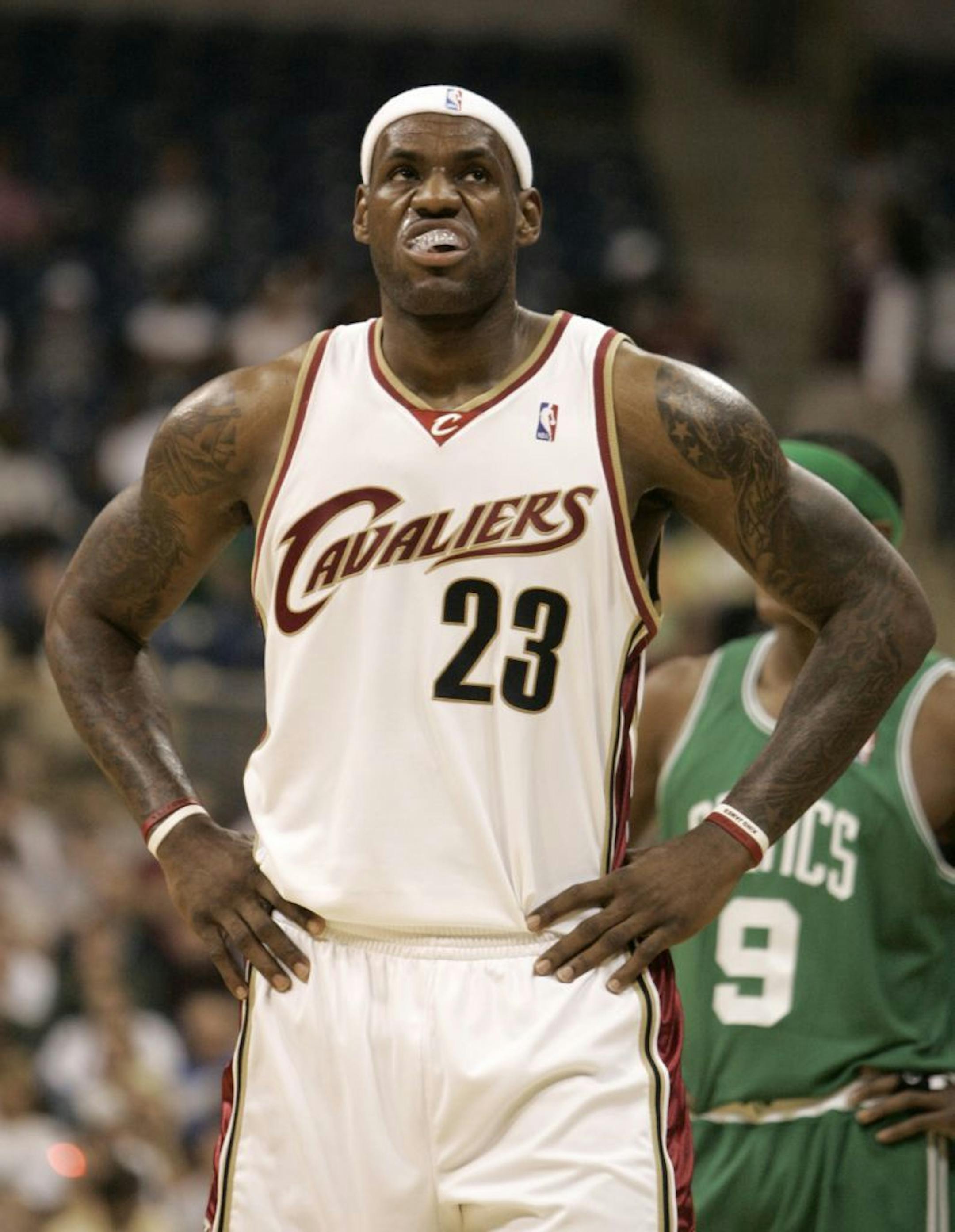 Cleveland Cavaliers' LeBron James looks up into the crowd in the NBA preseason basketball game against the Boston Celtics in Pittsburgh, Tuesday, Oct. 14, 2008.