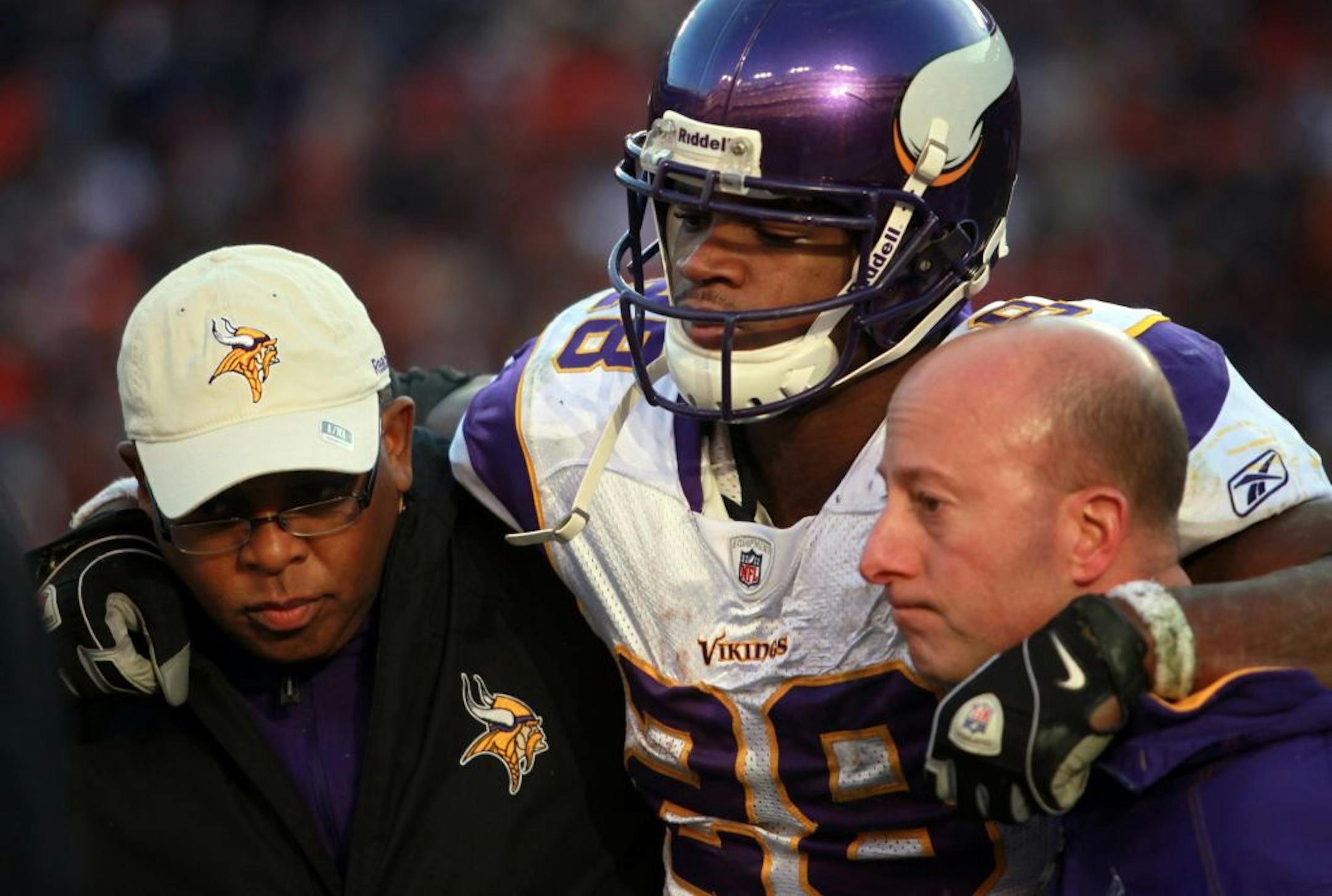 Adrian Peterson was helped off the field in December.