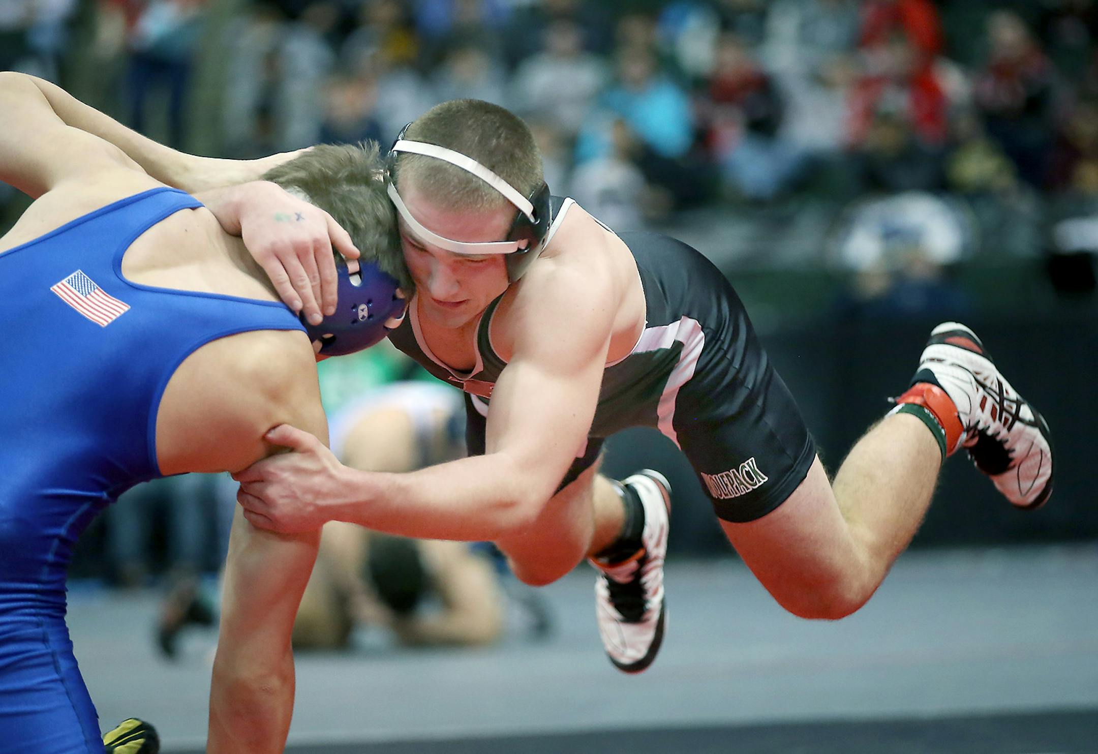 Park of Cottage Grove wrestler Cory Flaata, right, wrestled St. Michael-Albertville's Evan Ronsen during the Minnesota State High School League Wrestling State Tournament, Friday, February 27, 2015 at the Xcel Energy Center in St. Paul, MN. ] (ELIZABETH FLORES/STAR TRIBUNE) ELIZABETH FLORES • eflores@startribune.com