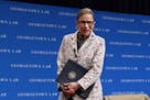 FILE - In this Sept. 26, 2018, file photo, Supreme Court Justice Ruth Bader Ginsburg leaves the stage after speaking to first-year students at Georget