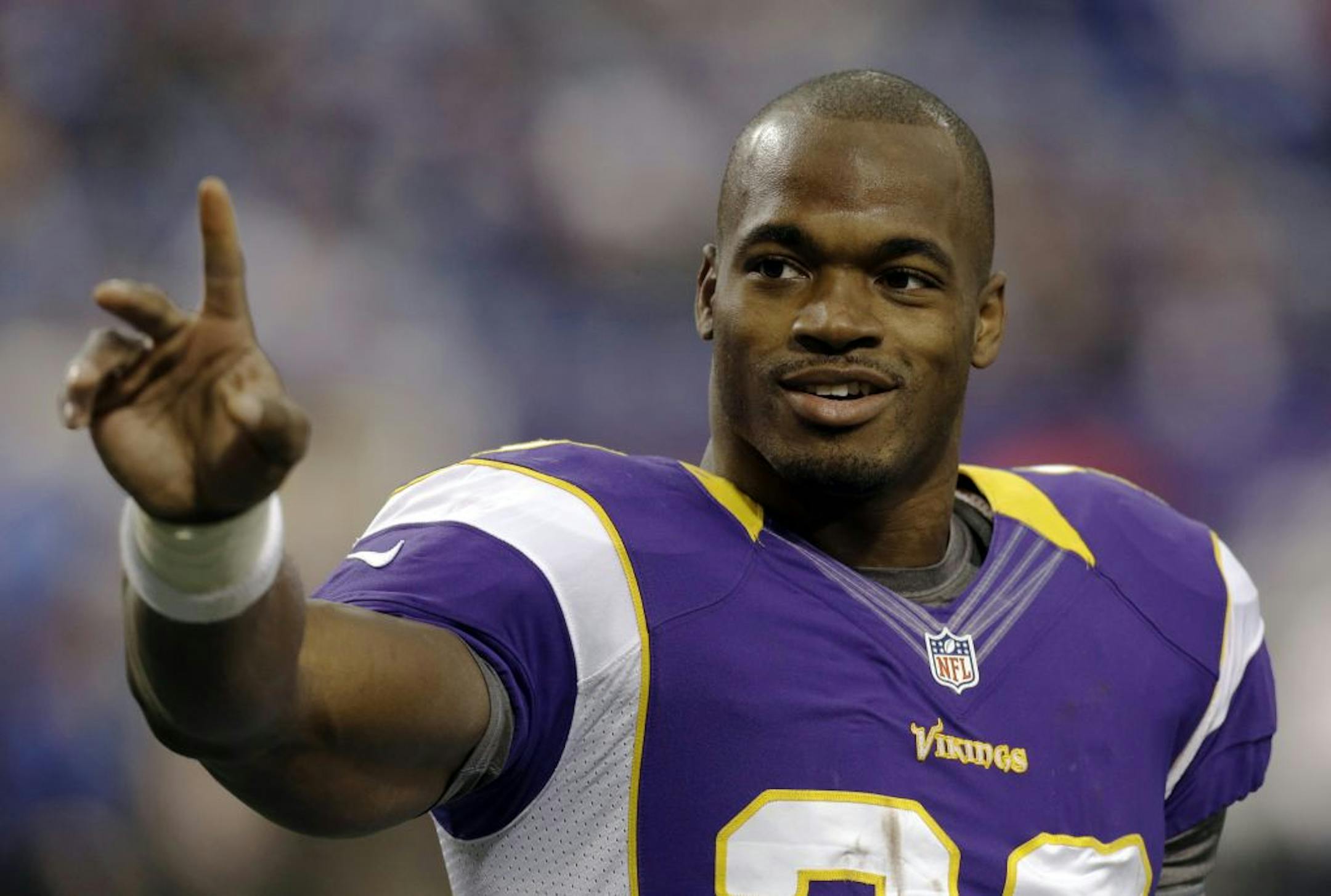 ADVANCE FOR WEEKEND EDITIONS, DEC. 15-16 - FILE - This Nov. 11, 2012 file photo shows Minnesota Vikings running back Adrian Peterson waving to fans before an NFL football game against the Detroit Lions in Minneapolis. Peterson has not only fully healed from an injury that can be devastating for running backs but come back better than ever.