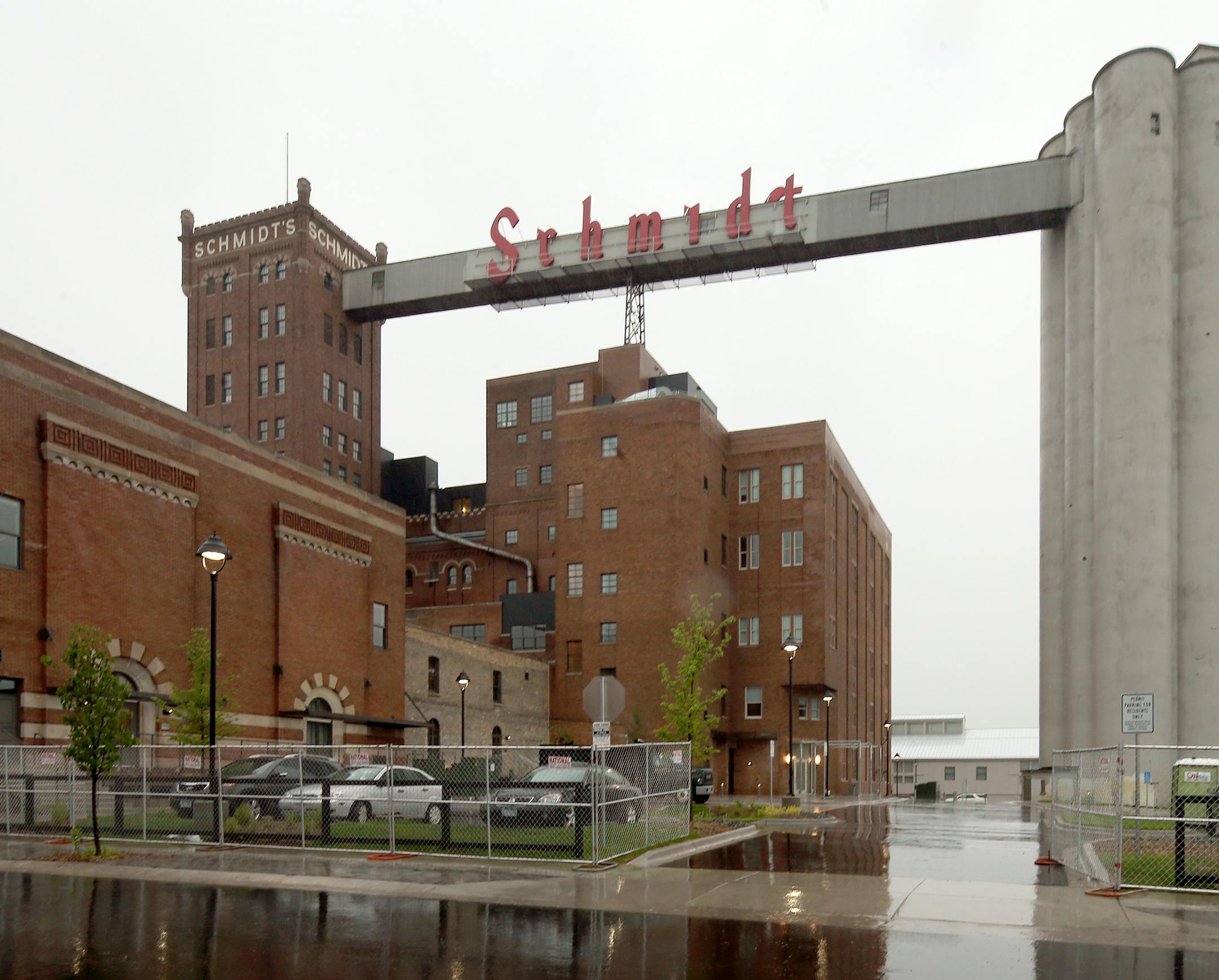 The old Schmidt brewery in St. Paul ] JOELKOYAMA‚Ä¢jkoyama@startribune St. Paul, MN on June 19, 2014. Less than two years after a Plymouth developer bought the property, the old Schmidt brewery in St. Paul has been transformed into a nearly fully booked artists housing complex that promises to infuse new life in the W. 7th area. The icing on the cake is the return of the iconic Schmidt sign, a full-scale replica of which has been installed and will be lit for the first time Satu