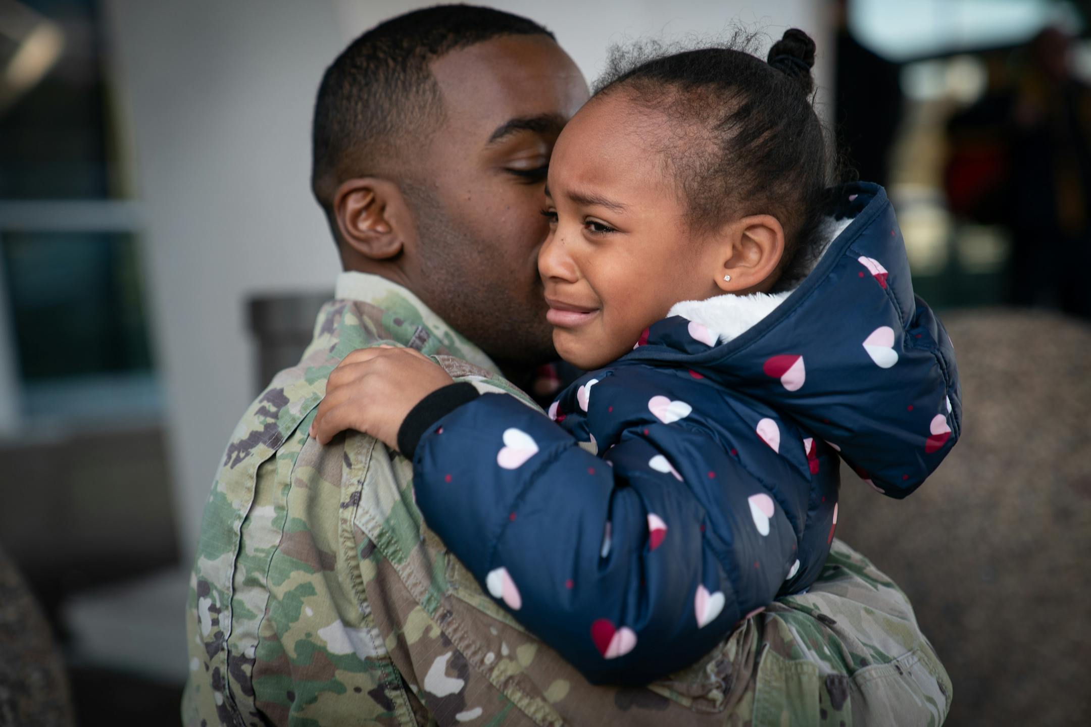 Deonte Haynes hugged his daughter, Jalei, 5, in early December at Minneapolis-St. Paul International Airport, where he was leaving to return to Fort Hood, Texas, before he leaves for the Middle East. He's a helicopter mechanic for the Army National Guard. He had come come for a few days of Thanksgiving.