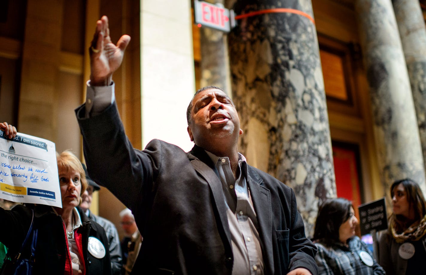 Pastor Brian Herron of the Zion Baptist Church, Minneapolis, prayed outside the Senate Chamber. ] GLEN STUBBE * gstubbe@startribune.com Thursday, April 23, 2015 Drivers license legislation has been added to the Senate Transportation Omnibus Bill. Prior to the vote, members of ISAIAH visited with legislators and held a faith rally and prayer vigil outside of the Senate chamber in the State Capitol.