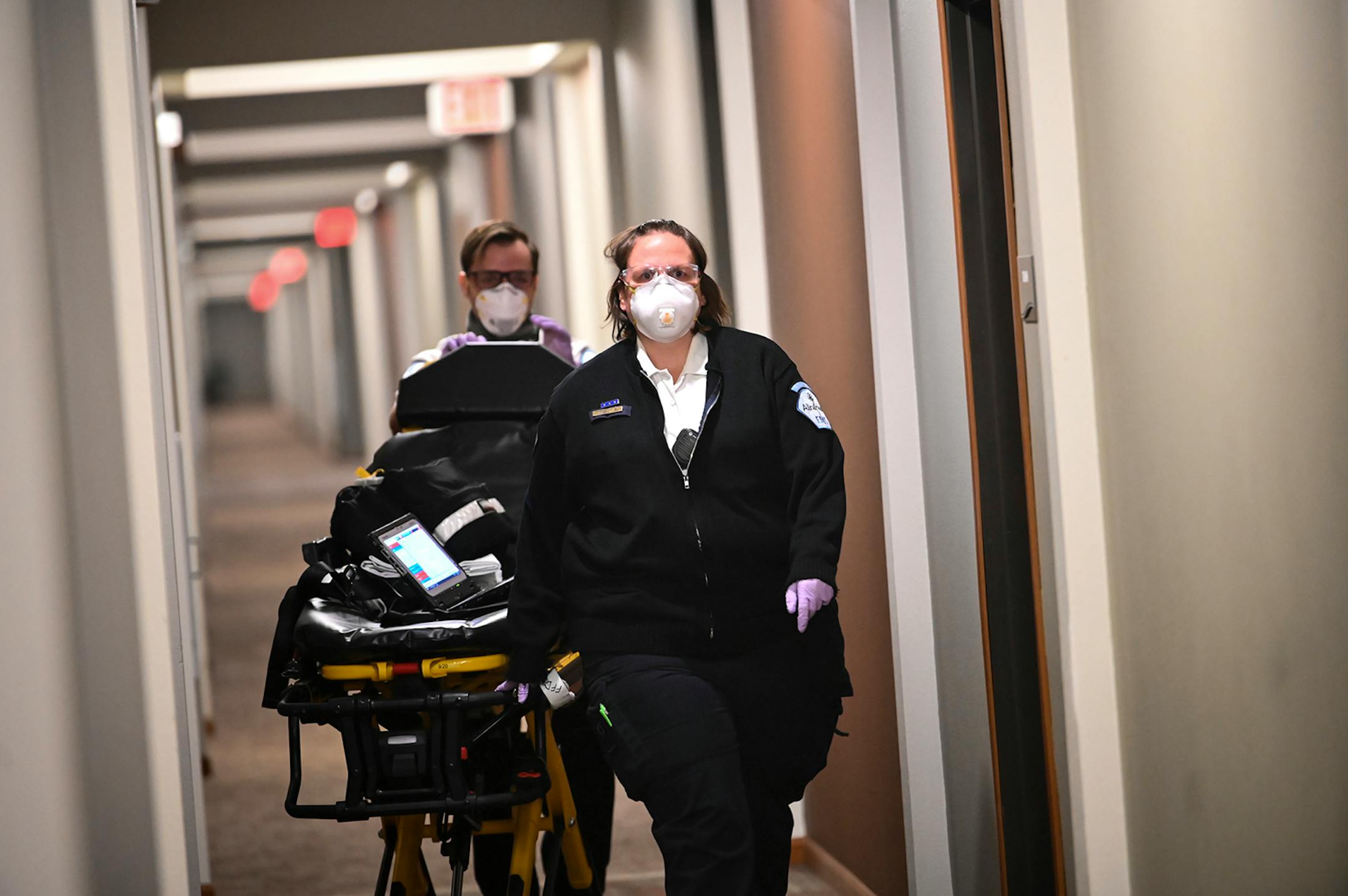Allina Health paramedics Crystal Gaughan and Gregory Harvey arrived at a patient's home in the north Metro Wednesday afternoon. The patient, a 12-year old, was displaying symptoms of COVID-19 and was having breathing trouble. ] AARON LAVINSKY • aaron.lavinsky@startribune.com Emergency medical workers and physician Andrew Stevens responded to possible COVID-19 related calls on Wednesday, Dec. 2, 2020 in the north Twin Cities metro.