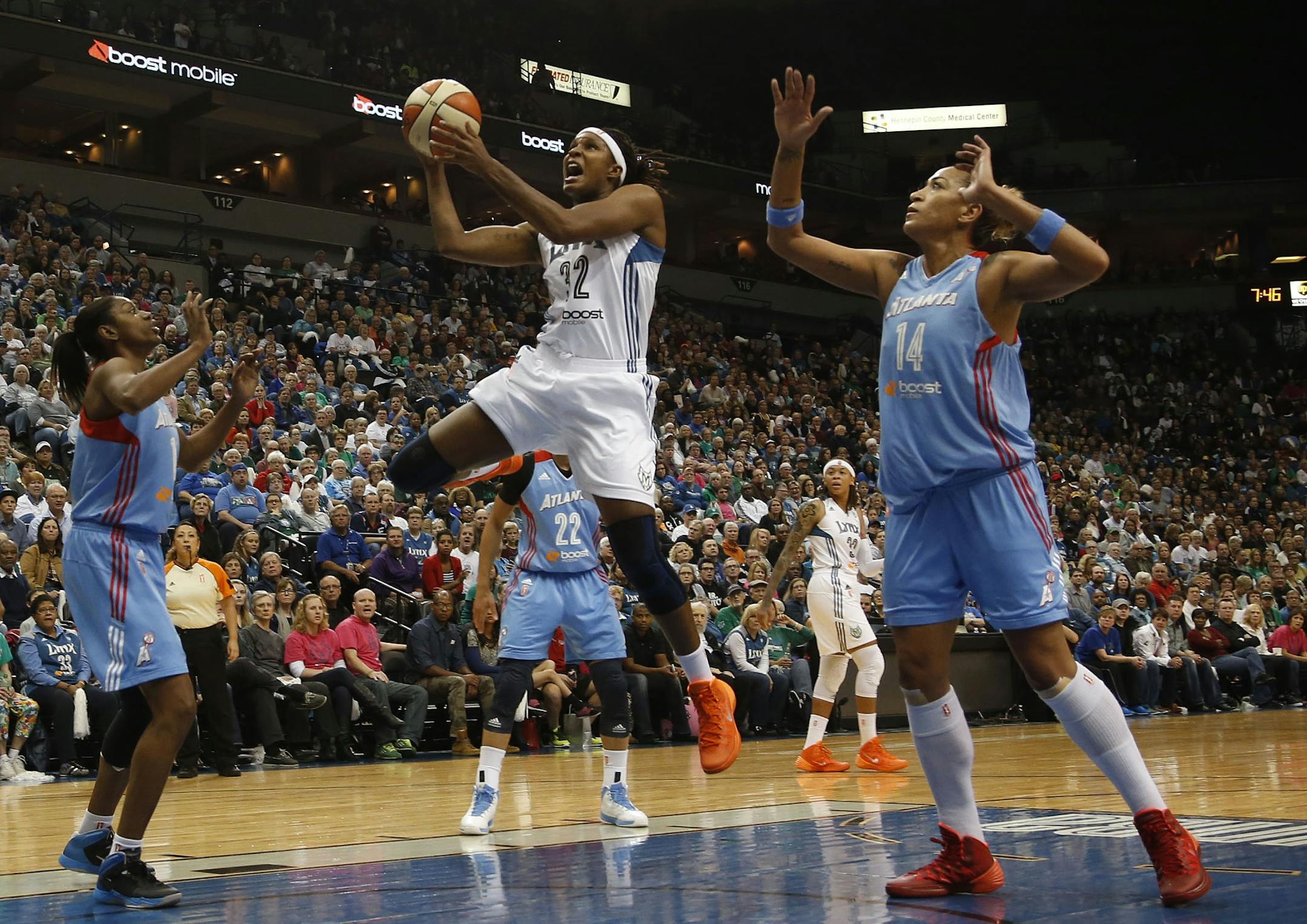 Rebekkah Brunson went up for a layup against the Dream's defense during the first quarter of the WNBA Finals at Target Center in Minneapolis on Sunday, October 6, 2013. Brunson had knee surgery on Tuesday and it out for at least two months.