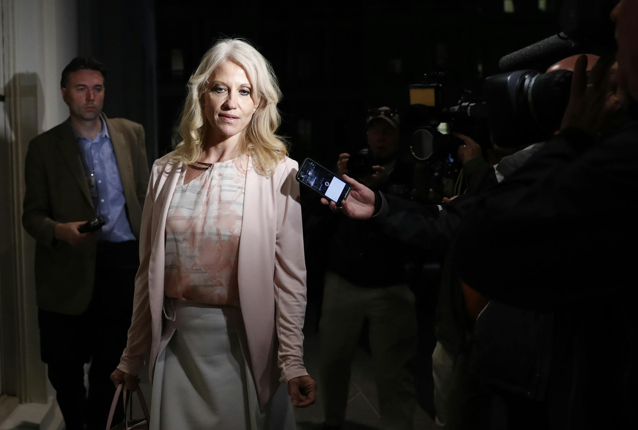 Counselor to President Donald Trump Kellyanne Conway talks to reporters as she walks into the West Wing of the White House, in Washington, Tuesday, May 9, 2017. President Donald Trump abruptly fired FBI Director James Comey on May 9, 2017, ousting the nation's top law enforcement official in the midst of an investigation into whether Trump's campaign had ties to Russia's election meddling. (AP Photo/Carolyn Kaster)