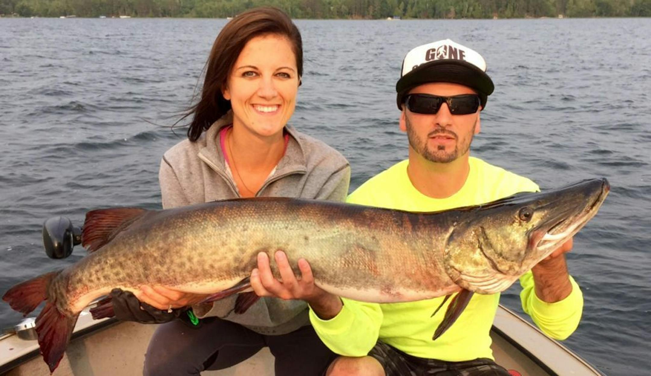 Stacie Hassing of Easton, Minn., with a 45.5-inch muskie she caught and released on Leech Lake. Helping her hold the fish is her brother, Nathan Stindtman of St. Joseph.