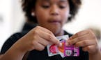 Yalanda Rivera 15, checks the expiration dates on condoms to put into safe sex kits. ] (Leila Navidi/Star Tribune) leila.navidi@startribune.com BACKGR