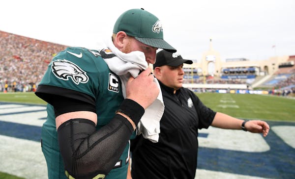 Philadelphia Eagles quarterback Carson Wentz walks off the field after injuring his leg against the Los Angeles Rams on Sunday, Dec. 10, 2017 at the C