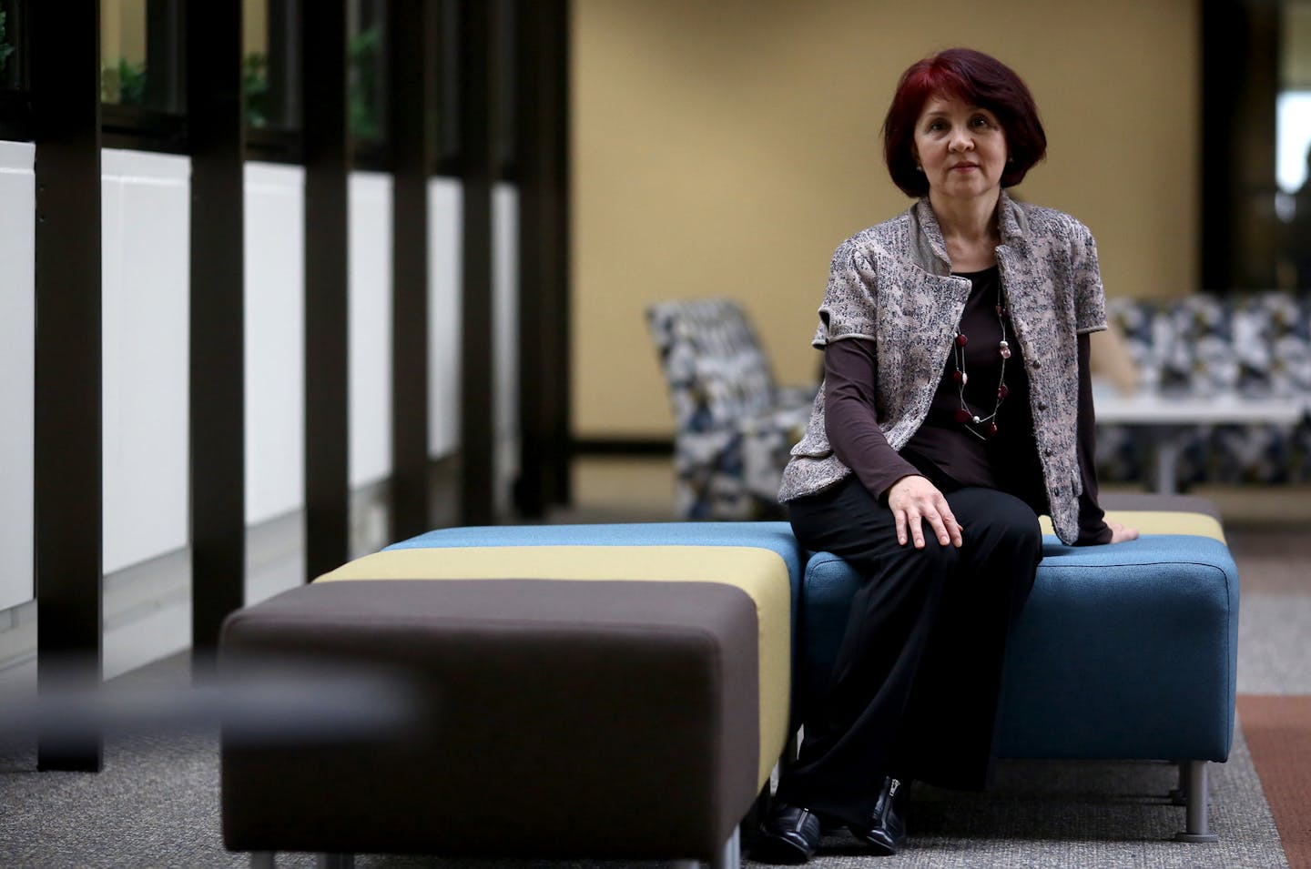 Nancy Asan is a new Hennepin County employee at the Hennepin County Board. Asan had finished a nine-month program that enabled he to get her job. ] (KYNDELL HARKNESS/STAR TRIBUNE) kyndell.harkness@startribune.com Nancy Asan who works at the front desk for the Hennepin County Board in Minneapolis Min., Thursday November 12, 2015. Hennepin County has created special nine-month college programs designed to turn social services clients into county employees and enrich the workforce for the anticipat