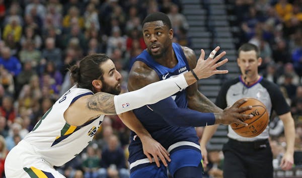 Utah Jazz guard Ricky Rubio, left, defends against Minnesota Timberwolves guard Jared Terrell during the first half of an NBA basketball game Friday, 
