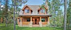 Home plan: Rustic cabin boasts modern amenities.