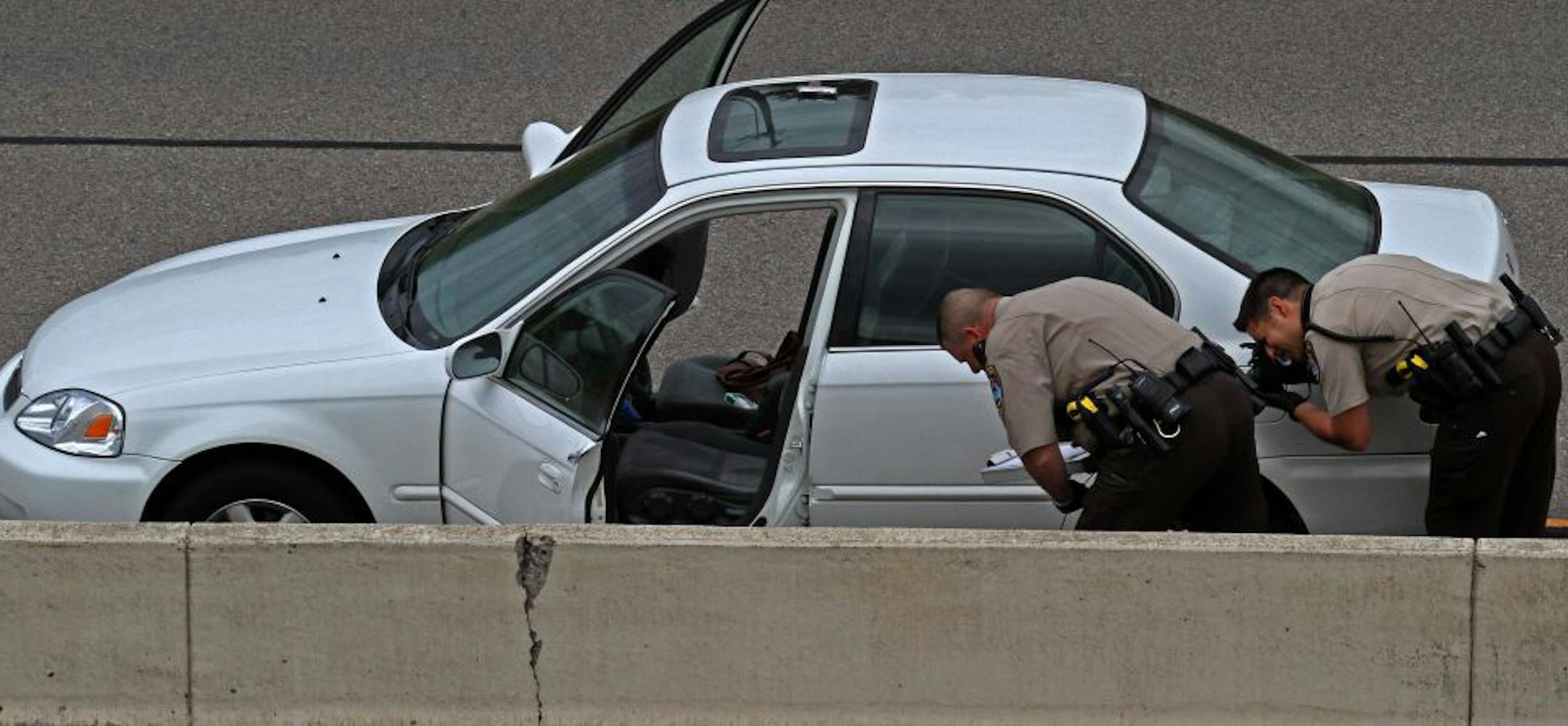 Investigators checked out the car driven by the woman who was shot by a Golden Valley police officer on Interstate 394.