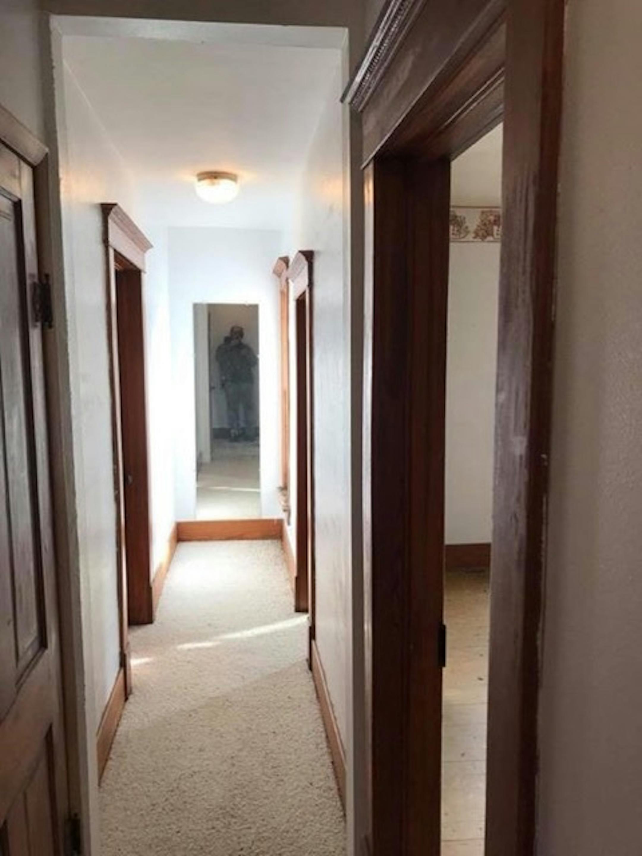 This Iowa farmhouse's owners restored the woodwork to its early 20th-century grandeur. They offered the house for free on Craigslist, and found a Minnesota taker. Courtesy Roger Dolecheck