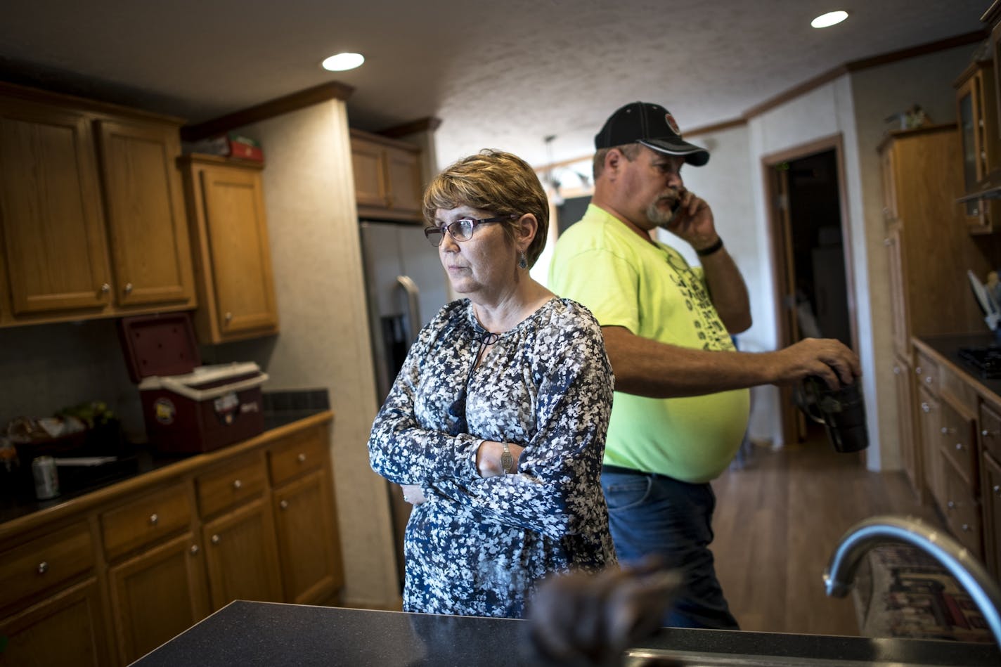 Brenda and Larry Daml were photographed in their kitchen after Larry arrived home from work.