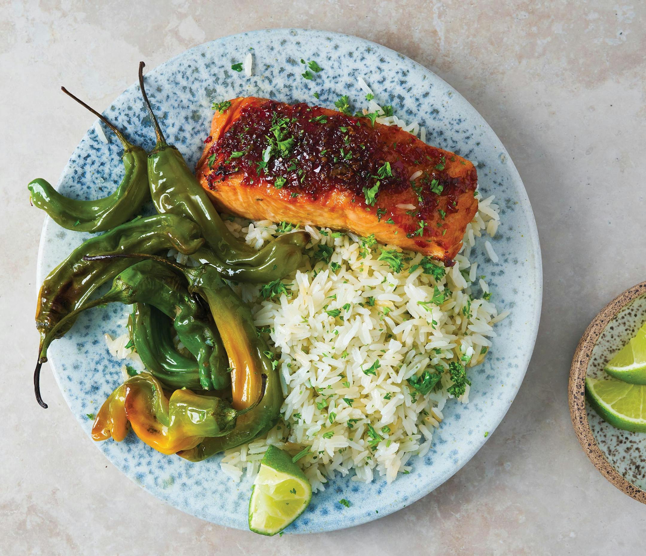 Pomegranate-Glazed Salmon with Coconut Rice. From "ScheckEats: Cooking Smarter," by Jeremy Scheck (Harvest, 2023). Provided