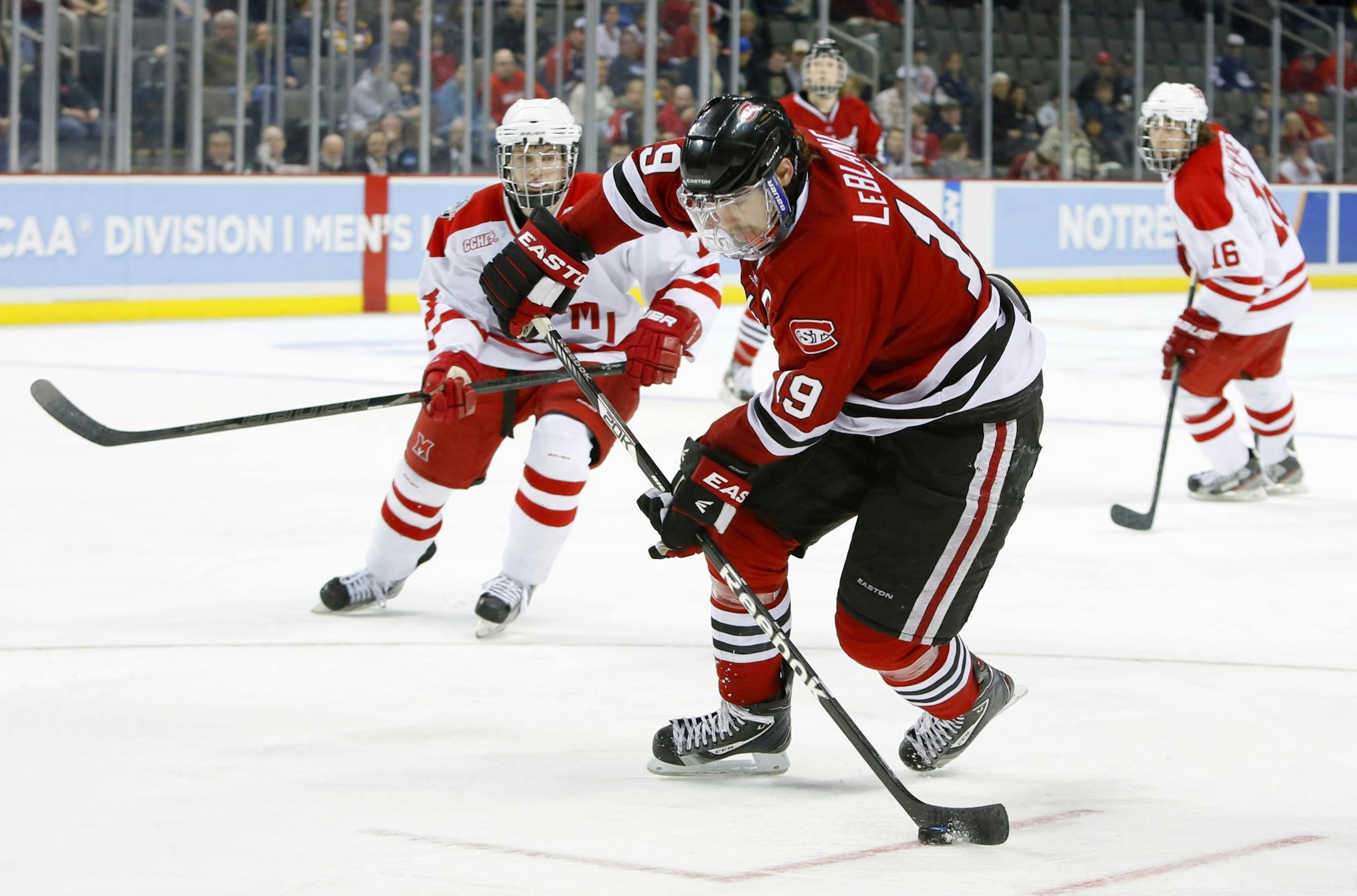 St. Cloud State's Drew LeBlanc (19) moves the puck against Miami (Ohio) during the third period of their regional final in the NCAA college hockey tournament, Sunday, March 31, 2013, in Toledo, Ohio. (AP Photo/The Blade, Andy Morrison) MANDATORY CREDIT; MAGS OUT; NO SALES; TV OUT; SENTINEL-TRIBUNE OUT; MONROE EVENING NEWS OUT; TOLEDO FREE PRESS OUT