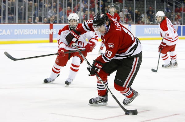 St. Cloud State's Drew LeBlanc (19) moves the puck against Miami (Ohio) during the third period of their regional final in the NCAA college hockey tou